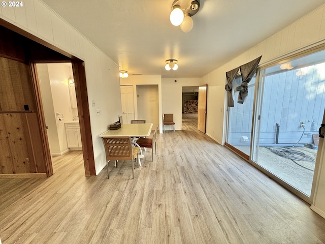 interior space featuring a breakfast bar area and light hardwood / wood-style flooring