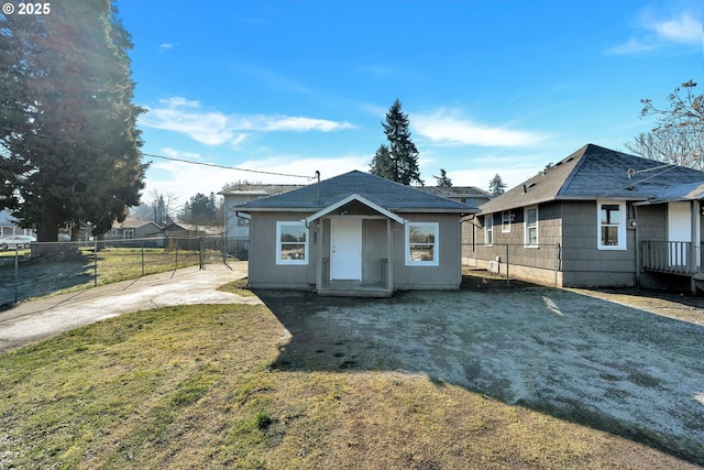 bungalow-style house featuring a front yard