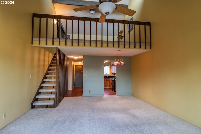 carpeted living room featuring ceiling fan