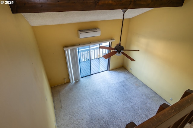 carpeted living room with ceiling fan, beamed ceiling, a textured ceiling, and a wall unit AC