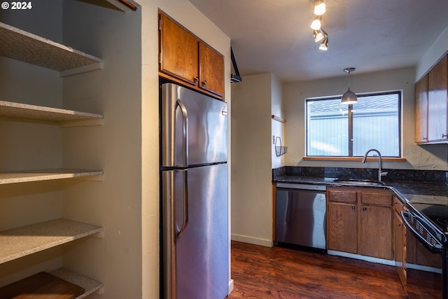 kitchen featuring stainless steel appliances, dark hardwood / wood-style floors, and sink