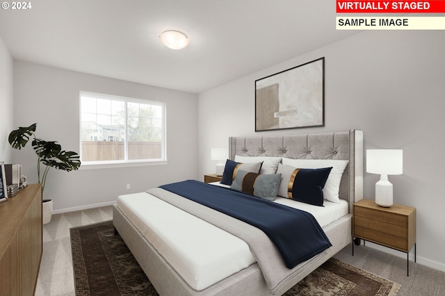 carpeted bedroom featuring baseboards