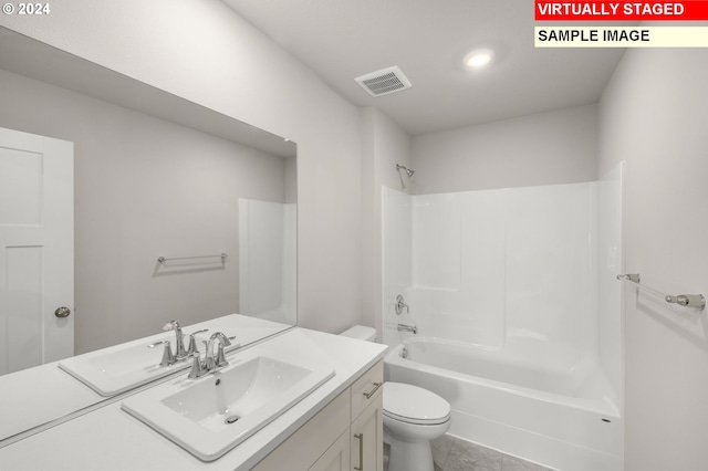 bathroom with visible vents, toilet, vanity,  shower combination, and tile patterned floors