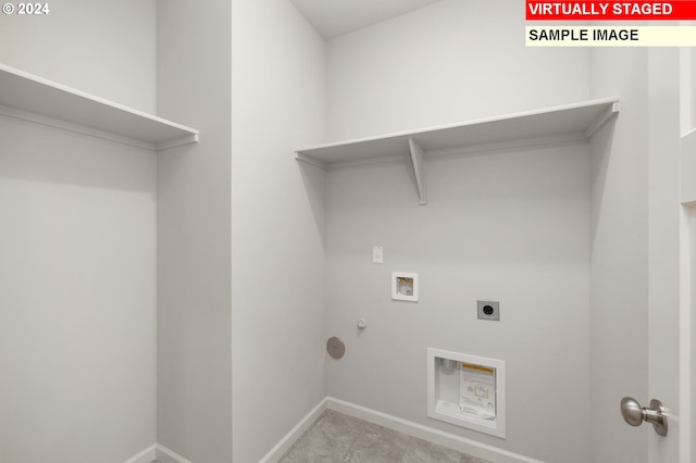 laundry room with gas dryer hookup, hookup for a washing machine, laundry area, baseboards, and electric dryer hookup