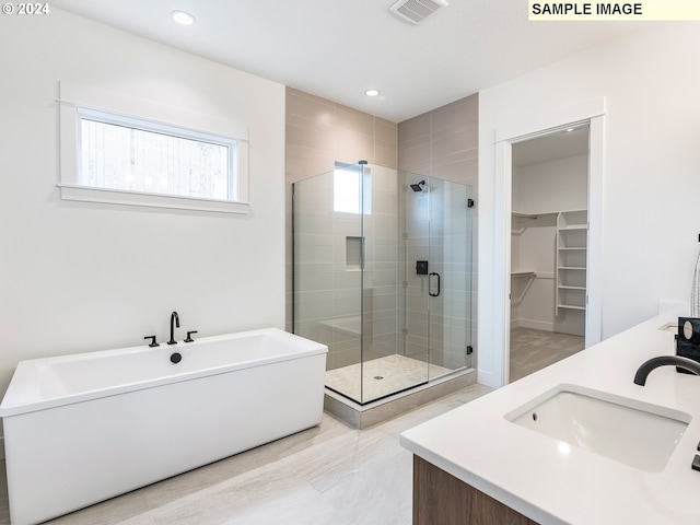 kitchen featuring a healthy amount of sunlight, sink, double oven, and light stone countertops