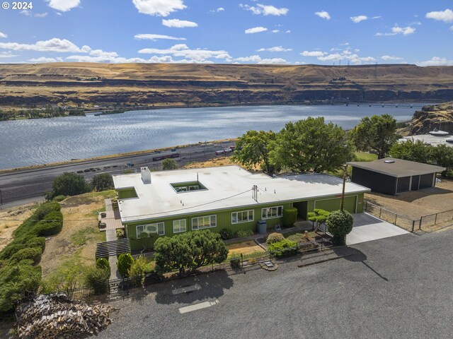 birds eye view of property featuring a water and mountain view