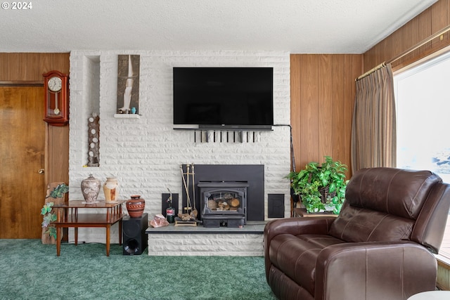 carpeted living area featuring a textured ceiling and wood walls