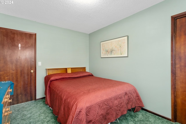 carpeted bedroom with a textured ceiling