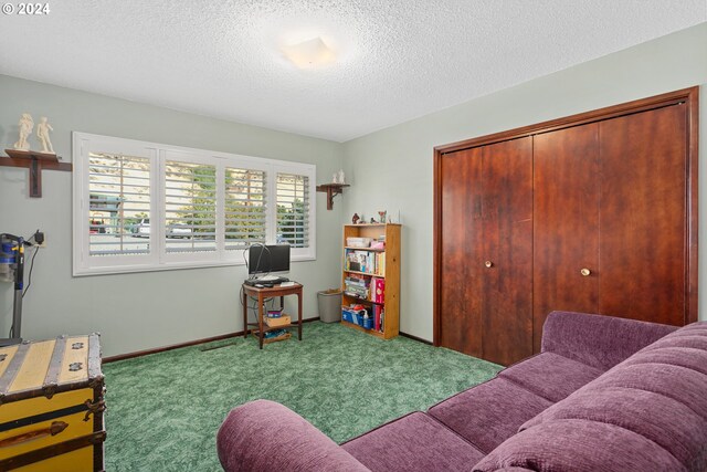 living room with light carpet and a textured ceiling