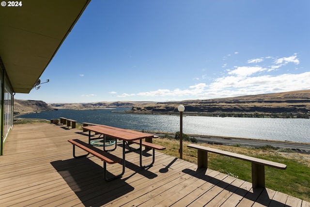 deck featuring a water view