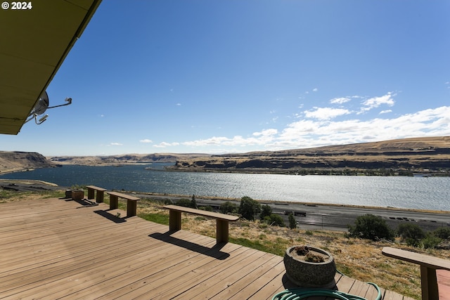 dock area with a deck with water view