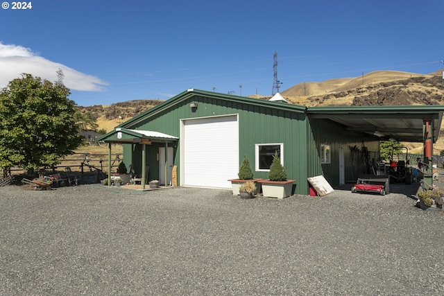 view of outbuilding with a mountain view