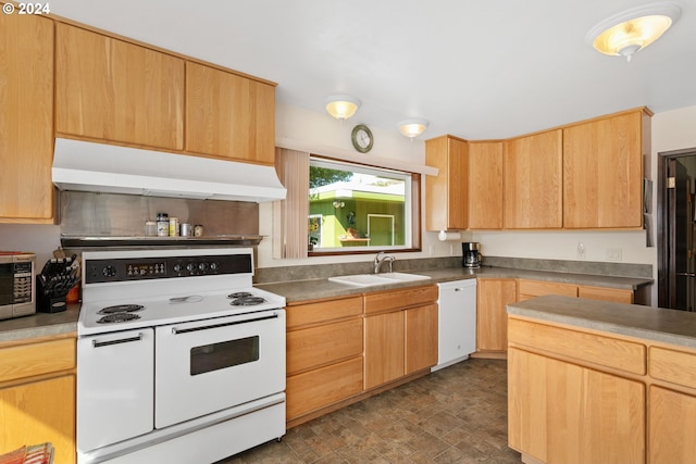 kitchen featuring under cabinet range hood, light brown cabinets, white appliances, and a sink