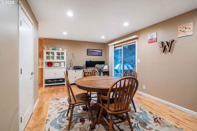 dining room with light wood-type flooring