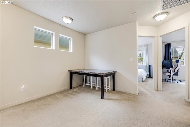 interior space featuring a textured ceiling