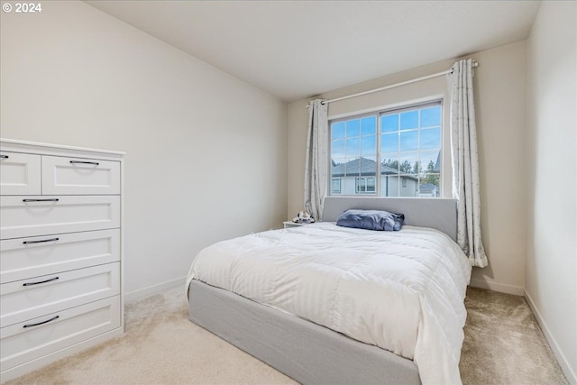 carpeted bedroom featuring lofted ceiling