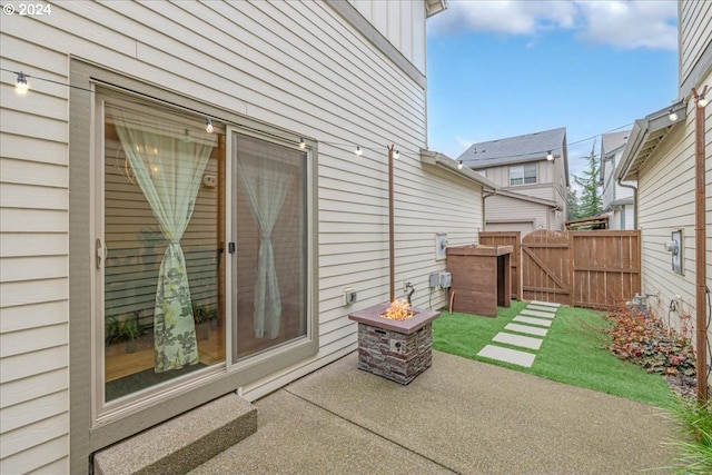 view of patio with an outdoor fire pit