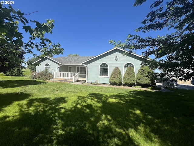 ranch-style home with a front yard