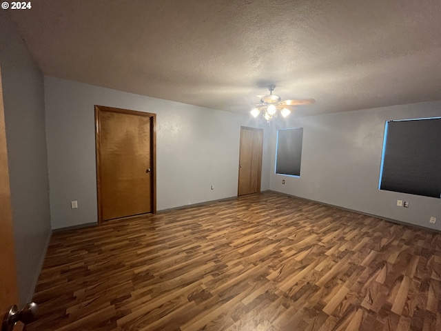 unfurnished room featuring a textured ceiling, wood-type flooring, and ceiling fan