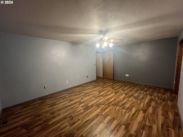 unfurnished room featuring hardwood / wood-style floors and ceiling fan