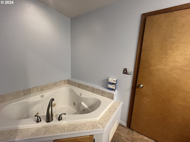 bathroom featuring tiled bath and tile patterned floors