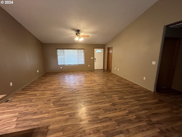 unfurnished room featuring wood-type flooring, vaulted ceiling, and ceiling fan