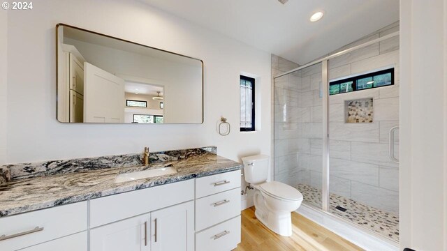 94256 11th St, Gold Beach, OR 97444 - bathroom featuring toilet, a shower stall, wood finished floors, vanity, and recessed lighting