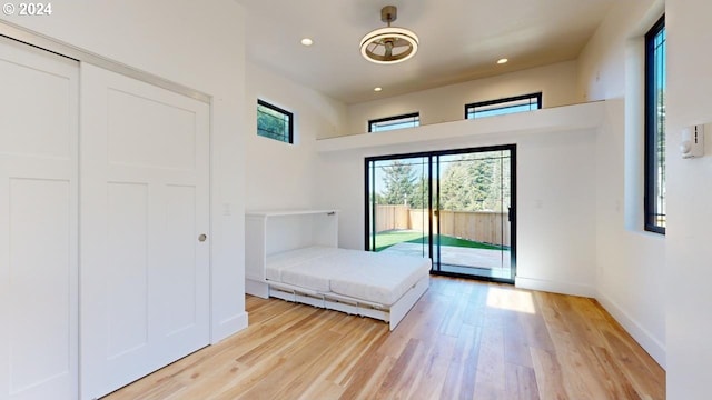 94256 11th St, Gold Beach, OR 97444 - bedroom featuring access to exterior, light wood-type flooring, recessed lighting, and baseboards