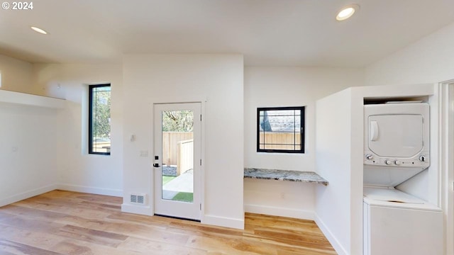 94256 11th St, Gold Beach, OR 97444 - doorway with stacked washer / drying machine, light wood-type flooring, baseboards, and recessed lighting