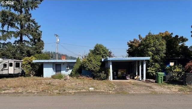 view of front of house with a carport