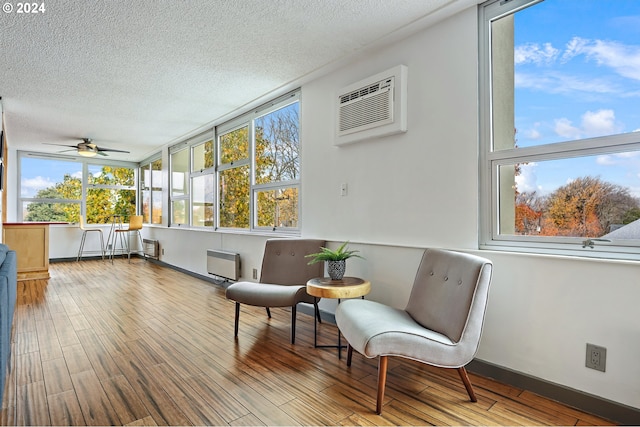 1220 NE 17th Ave Unit 4C, Portland, OR 97232 - sunroom / solarium with healthy amount of natural light and a wall unit AC