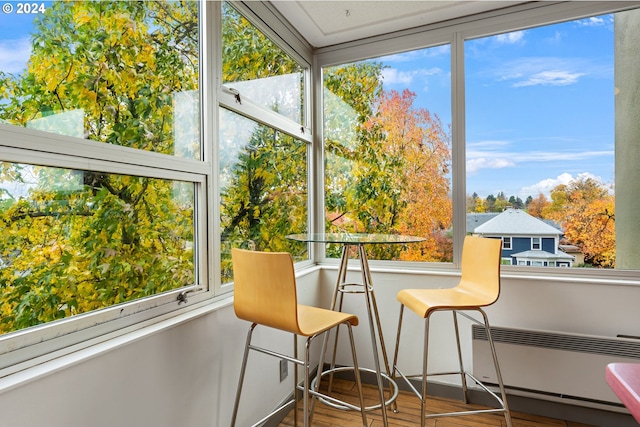 1220 NE 17th Ave Unit 4C, Portland, OR 97232 - sunroom featuring radiator heating unit