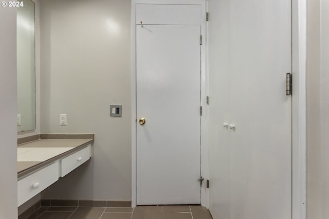 1220 NE 17th Ave Unit 4C, Portland, OR 97232 - bathroom featuring tile patterned floors, vanity, and baseboards