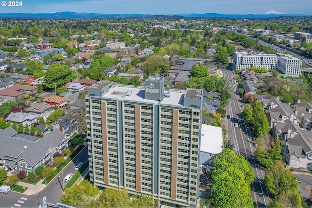 birds eye view of property with a mountain view