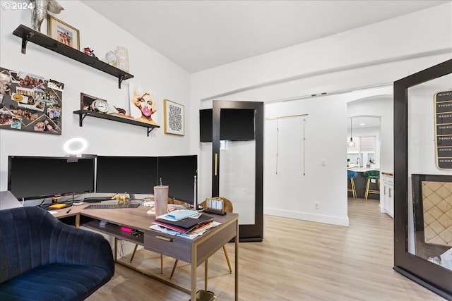 office area with light hardwood / wood-style flooring