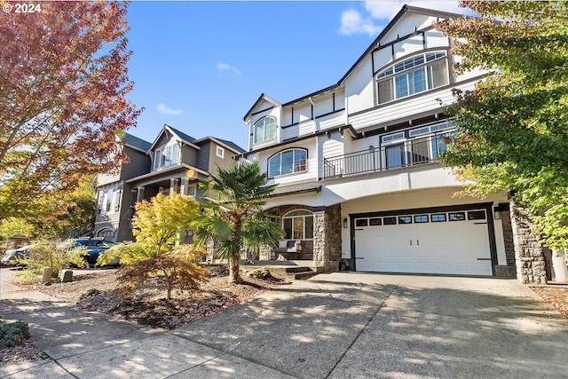 view of front of house with a balcony and a garage