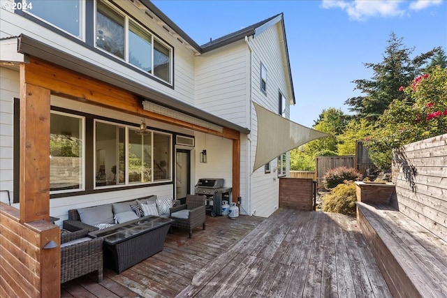 wooden deck with area for grilling and outdoor lounge area