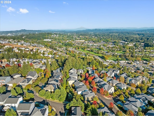 birds eye view of property with a mountain view