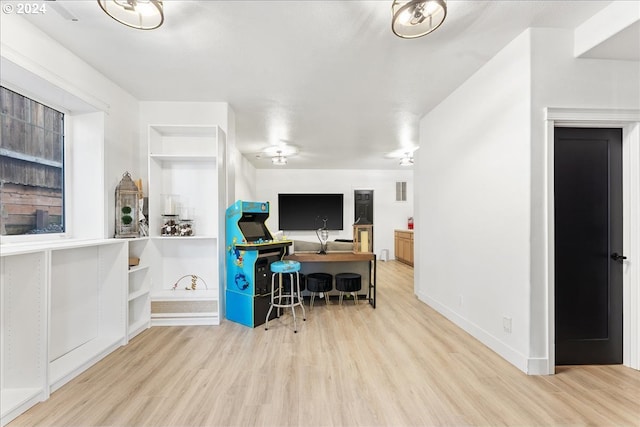 office with light hardwood / wood-style flooring