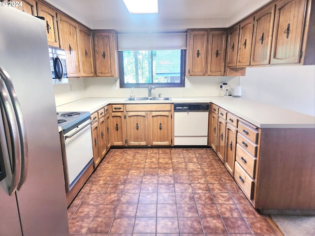 kitchen with sink and appliances with stainless steel finishes