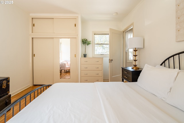 bedroom featuring hardwood / wood-style flooring and a closet