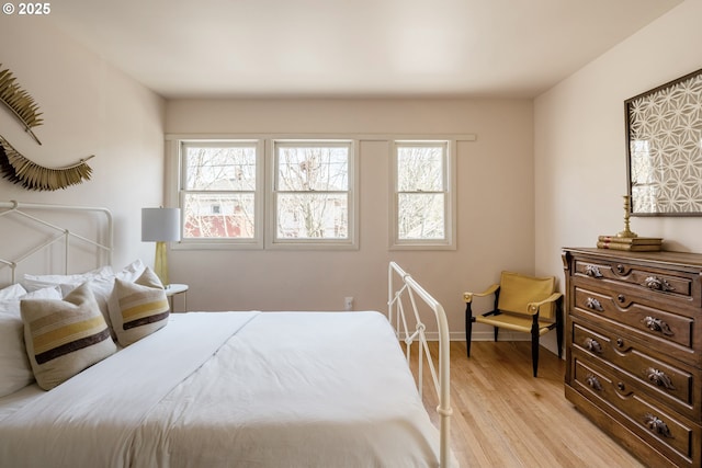 bedroom with light hardwood / wood-style flooring