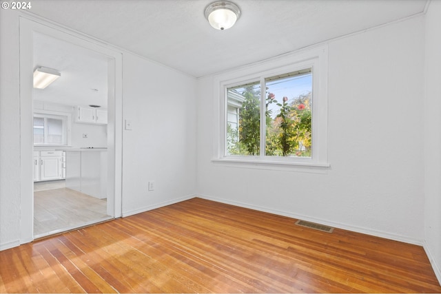 unfurnished room featuring light hardwood / wood-style flooring