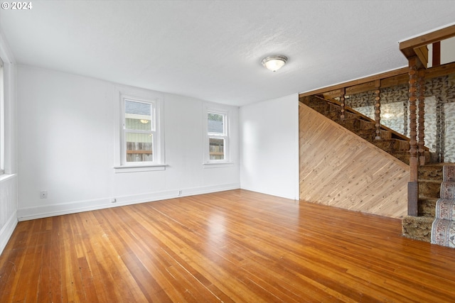 unfurnished room featuring hardwood / wood-style flooring