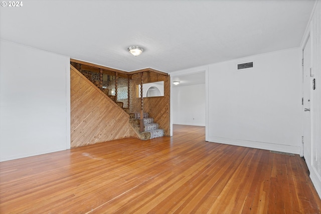 unfurnished living room featuring wood-type flooring