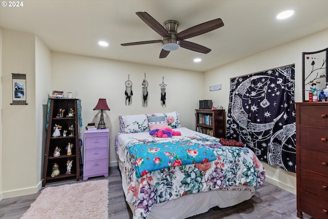 bedroom featuring wood-type flooring and ceiling fan