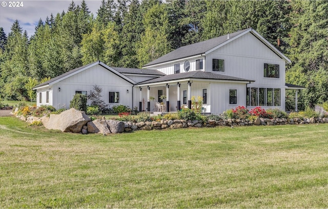 modern inspired farmhouse with a front yard