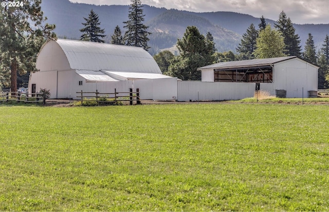 view of yard featuring an outbuilding and a mountain view