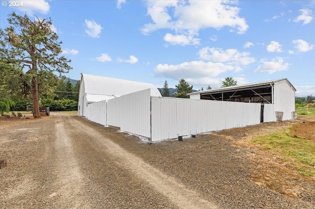 view of side of home with an outbuilding