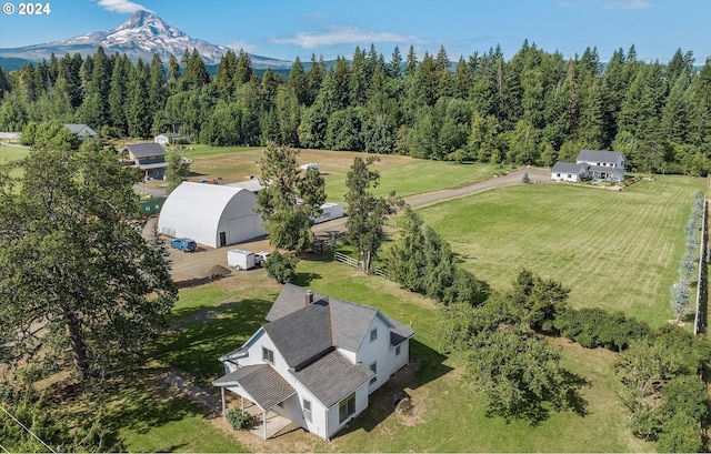 drone / aerial view featuring a mountain view and a rural view